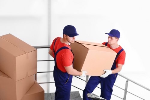 Packed boxes and furniture prepared for a small house move in Sidcup