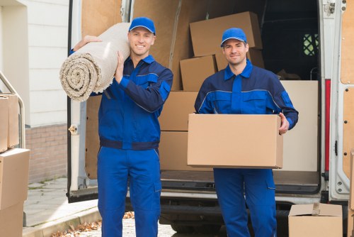 Professional movers handling flat removals in Sidcup outside an apartment building
