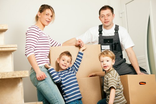 Furniture being carefully carried down stairs during a flat move in Sidcup