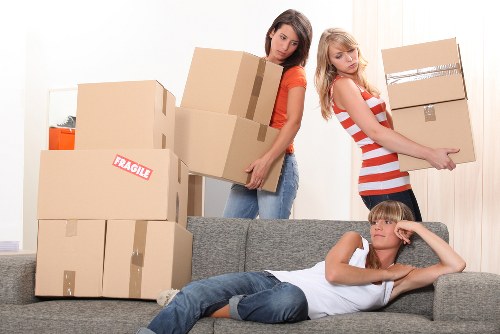 Domestic removals team packing household items in Sidcup